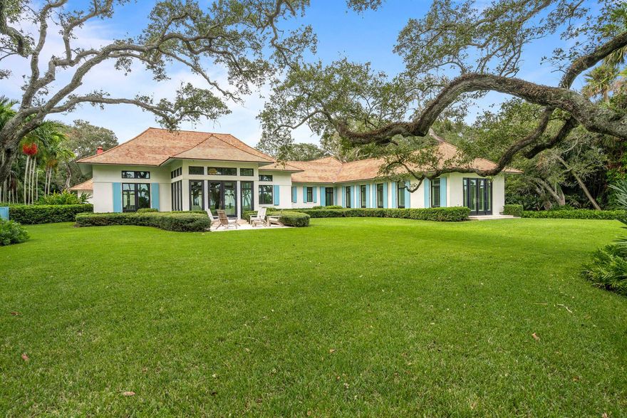 This meticulously designed home is poised on nearly an acre with sweeping fairway views over the historic Old Riomar golf course. Sophisticated elegance and modern conveniences are showcased throughout this 2014 custom-built home, complete with a NEW Wallaba shake roof. Indulge in timeless finishes, including extensive millwork, a chef's kitchen, luxury baths, attentive ceilings, and seamless indoor/outdoor living spaces. Merging the enduring design of an award-winning Architect with superior craftsmanship, this is an iconic offering.
