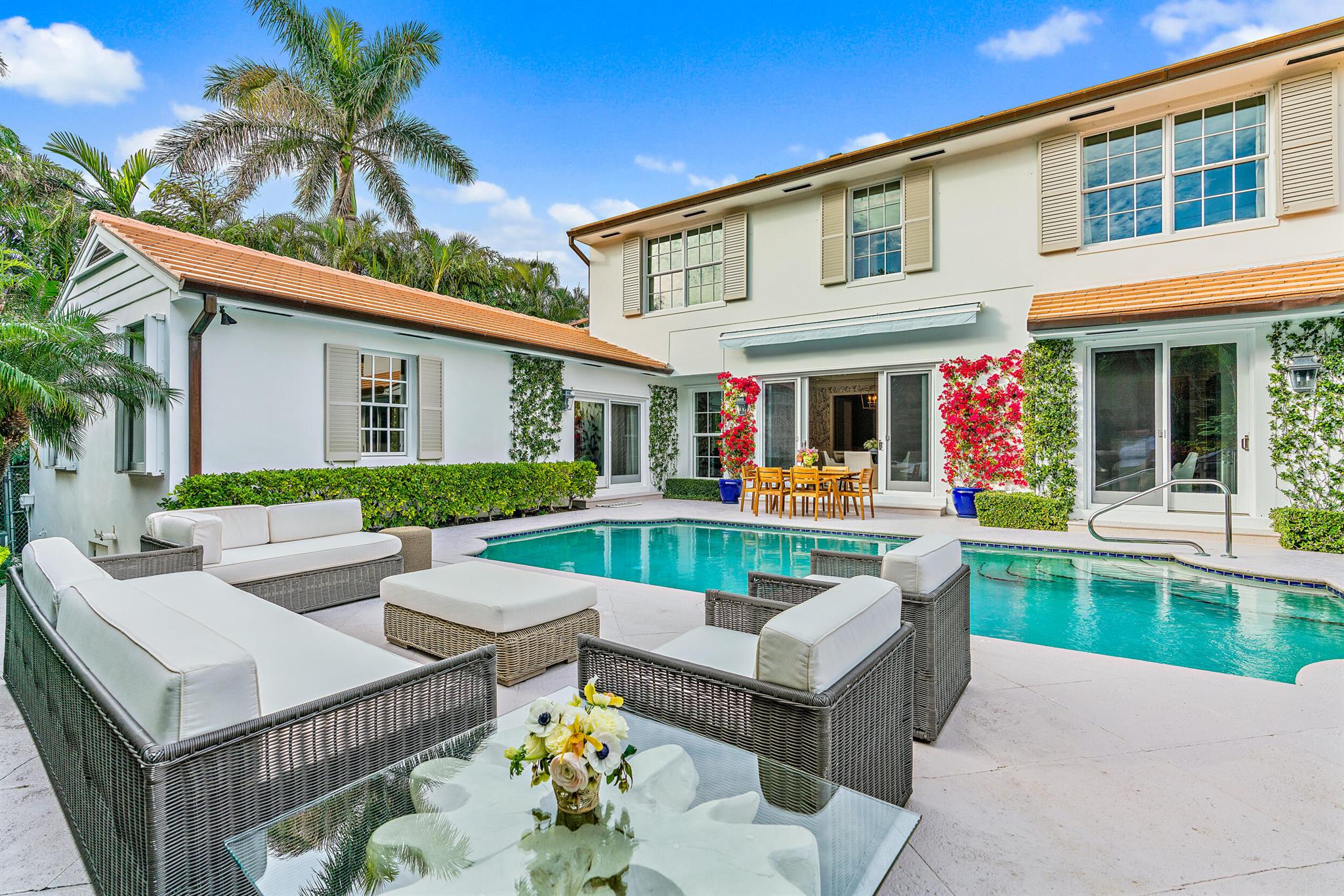 Beautifully appointed 4BR / 5.3BA Palm Beach home nestled in a private cul-de-sac close to lake trail access. Mature tropical trees and plants surround the sunny pool area for complete privacy. This lovely floor plan includes a large first-floor primary suite with dual bathrooms, living room with a fireplace, spacious dining room, gourmet kitchen with stainless steel appliances, guest bedroom and bath on the first floor and 2 additional bedrooms upstairs. Additionally there is a generator and 2 car garage. Close proximity to all Palm Beach has to offer including beaches, shopping and dining destinations.