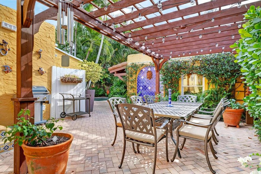 Welcome to 348 Plymouth Road!  This home is a rare opportunity to own one of the finest and most authentic Mediterranean Revival properties in the Belaire Historic District.  It is ideally located in the highly desirable locale of SoSo in West Palm Beach. This unique home offers unbeatable access to downtown West Palm Beach, Palm Beach International Airport, Antique Row, Worth Avenue, I-95, South Olive Tennis Center, and SoSo's growing collection of restaurants and boutiques. Set in tropical landscaping, this thoughtfully restored residence honors its architectural heritage while offering modern amenities for today's lifestyle.
The main house offers three bedrooms and two full bathrooms, with a private primary retreat that is separated from the main living area, allowing exceptional privacy and space. The primary retreat features a dressing room and its own outdoor patio that is perfect for quiet mornings or relaxed evenings. The ensuite bathroom has a view to the tropical gardens surrounding the pool.
Original details have been carefully preserved and updated, including beautifully refinished Dade County pine floors and pecky cypress ceilings and beams, which create warmth and authenticity throughout the home. The bedroom closets are unusual for the home's era given their large size.  New 2020 roofs and impact-resistant window film on all original windows provide added peace of mind without sacrificing original architectural details.
The kitchen is in a Mediterranean style, as well.  It has all the amenities for a chef, such as plenty of prep and storage space, a gas range, and pantry, all of which is ideal for both everyday cooking as well as entertaining.
The charming cottage is equipped with a full three-piece bathroom, kitchenette, large closet, and central HVAC that is ideal for hosting guests, creating a home office, or accommodating multigenerational living. 
The tropical backyard is designed for entertaining and relaxation featuring a pool, covered lounge area, pergola-covered dining area, and ample patio space. Combined with the cottage, it is suitable for gatherings of up to 50 guests.