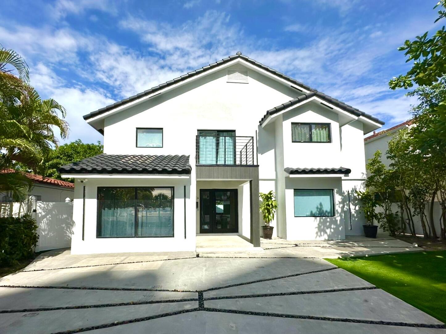 Modern Coastal Elegance in the Heart of Fort Lauderdale Beach! Experience elevated beachside living in this impeccably renovated 4-bedroom, 4.5-bathroom home just steps from the ocean, world-class dining, and premier shopping.. This home renovated, blends contemporary design with comfort and convenience, featuring sleek porcelain tile flooring throughout, granite countertops, and luxurious smart toilets in every bathroom.Every detail has been thoughtfully updated--from designer lighting and stylish accent walls to open-concept living spaces perfect for entertaining. The gourmet kitchen boasts high-end finishes and flows seamlessly into the sunlit living area. Each spacious bedroom includes an en-suite bathroom, offering privacy and spa-like tranquility.