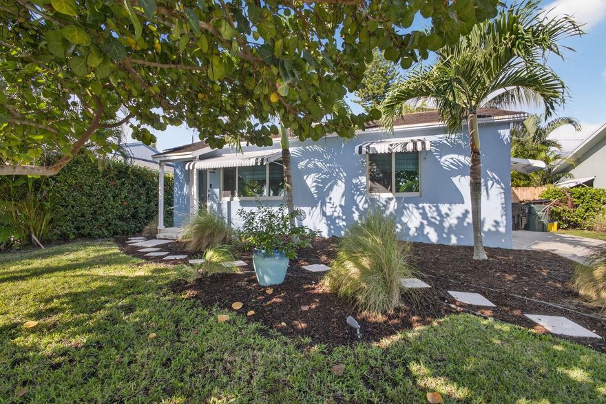 Welcome to 1711 N K Street in Lake Worth Beach! This charming 2-bedroom, 1-bathroom CBS home blends classic character with modern updates. Inside, you'll find original hardwood floors that add warmth and charm throughout. The kitchen has been beautifully updated with stainless steel appliances and contemporary finishes, and the bathroom has been tastefully renovated as well. Enjoy peace of mind with all-new impact windows and doors plus a brand-new central A/C system. The backyard is built for entertaining with a covered patio and a fully fenced yard -- perfect for outdoor dining, relaxing, or letting pets play. Just minutes from downtown Lake Worth Beach, local shops, and the ocean, this home is move-in ready and full of Florida charm.  Downtown and the beach are just minutes away!