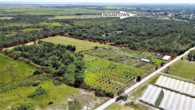 22+ Acre Nurcery. About a quarter of the property (south side) is where the 54 greenhouses are (most are without platic) That is the side where the road is. The greenhouses have a functioning irrigation system that is hooked up to a 5 hp submerged pump that is sitting in well. The property also has access to city water and electricity. The greenhouses will need new plastic and some will need new posts but the galvanized steel are in good condition. On the north side of the property you have an estimated 10 acres that are leveled and cleared. There is approximately 5 acres of mango trees. The property sitting off of a main road and The property does not flood when it rains heavily.