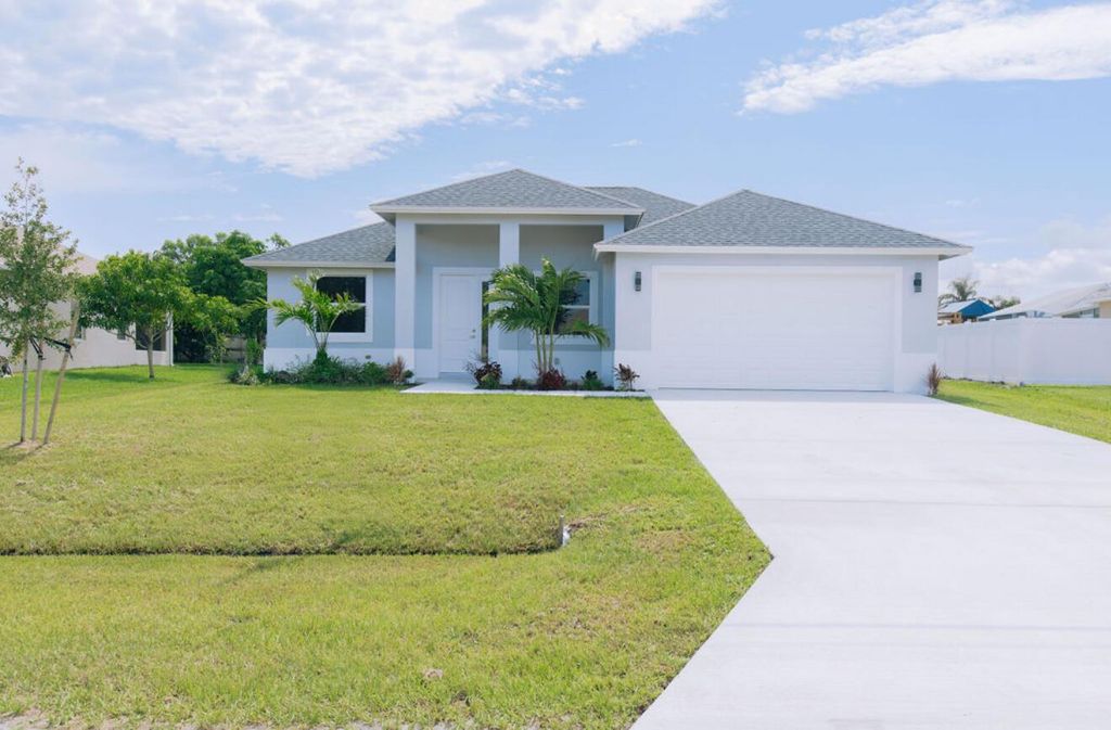 Photo of 5941 NW Center Street, Port Saint Lucie, FL 34986 (MLS # R11105725)