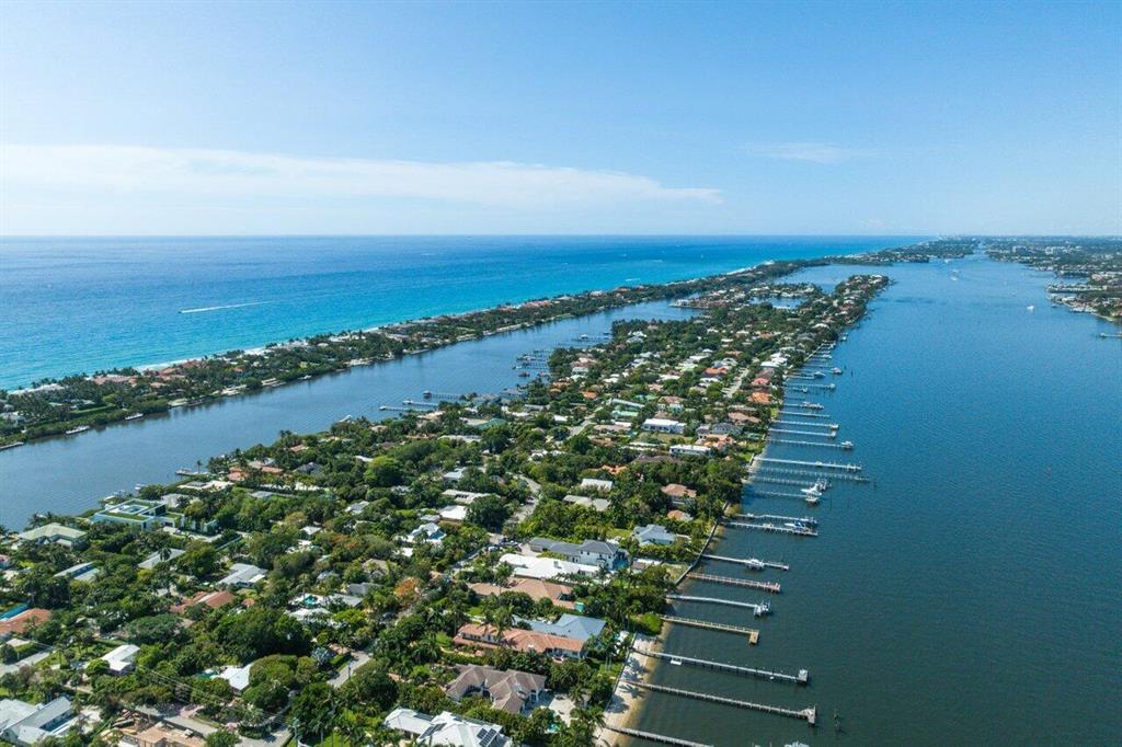 Tucked Away Behind Lush Tropical Landscaping, In The Exclusive Beach Enclave Of Hypoluxo Island, Your Private Oasis Awaits :: Boasting Over 3,100 Sqft Of Pure Elegance | 3 Large Suites - Each With Their Own Private En-Suite Bathroom & Sitting Area | Additional Office Space | 2 Full Kitchens - One Dedicated To Serve Guests By The Pool | Butler's Pantry | Marble Flooring Throughout | Covered Loggia | Heated Pool | Oversized 2-Car Garage & Much More! :: Short Walking Distance To The Beach, Great Restaurants, Shopping, and The Renowned EAU Resort & Spa. Centrally Located Between Delray & Palm Beach, You Can Enjoy The Best Of Both Worlds & Quickly Return To Your Private Enclave, Away From The Hustle & Bustle Of City Life! Paradise Is Calling! Schedule Your Private Showing Today!