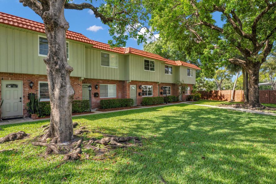 Super clean Townhouse located in Manor Grove Village!! This unit has just been freshly painted all neutral white and is ready to sell! Newer AC , hurricane windows & doors. Easy floor plan with large living room that extends to the granite kitchen, dining area, 1/2 bath, washer dryer, hurricane slider off the rear out to nice fenced in private area, a retreat for entertaining, relaxing and BBQ's with friends/family. Upstairs you will find 2 very ample size bedrooms & closets, full bath.  Community is well maintained includes, pool, clubhouse, pet friendly community with no restrictions on breed or sizes. Awesome location, walking distance to Wilton Drive and enjoy all the restaurants and shops. Minutes away from parks and beaches!!