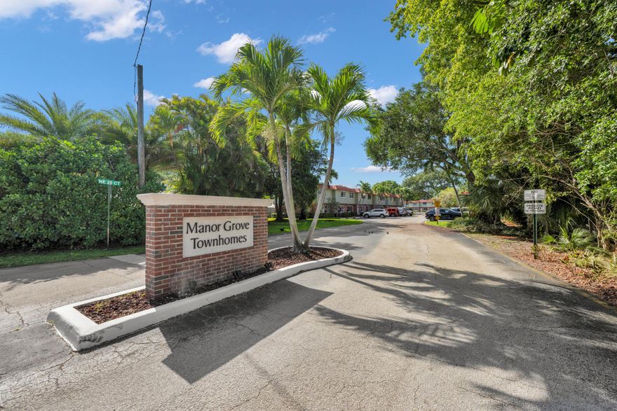 Wow, here it is, priced to sell! Fabulous Townhouse located in Manor Grove Village Wilton Manors. This ideal TH has newer AC and all hurricane windows & doors. Nice easy floor plan with large living room that extends to the granite kitchen, dining area, 1/2 bath, washer dryer, hurricane slider off the rear out to nice fenced in private area, a retreat for entertaining, relaxing and BBQ's with friends/family. Upstairs you will find 2 very ample size bedrooms & closets, full bath.  Community is well maintained includes, pool, clubhouse, pet friendly community with no restrictions on breed or sizes. Awesome location, walking distance to Wilton Drive and enjoy all the restaurants and shops. Minutes away from parks and beaches!! You will love this place & want to make this your next dream home!