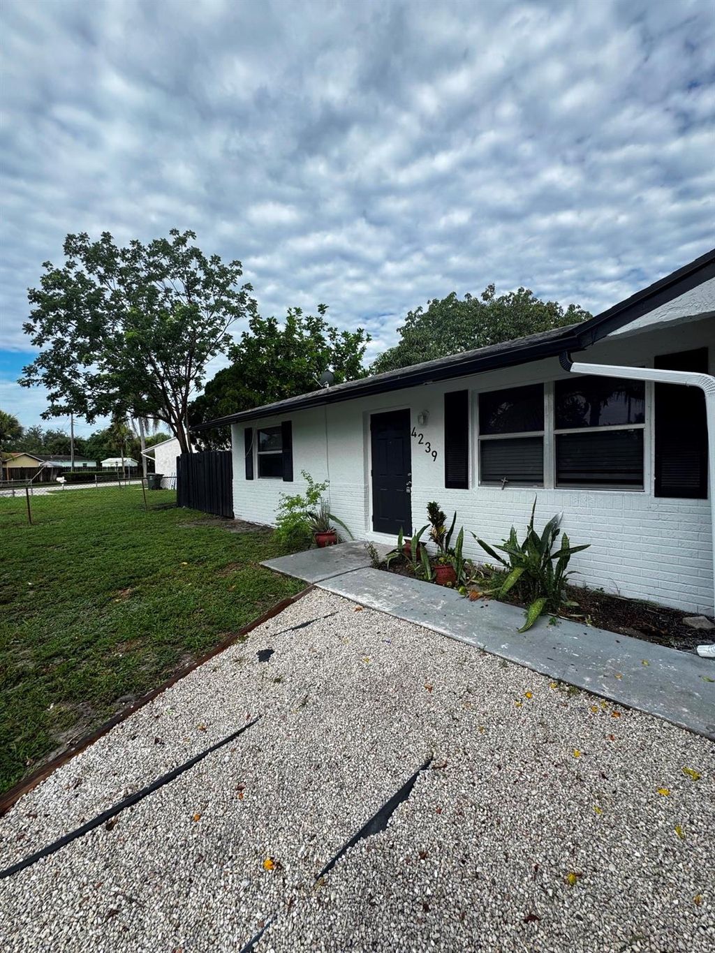 Photo of 4239 Empire Way, Greenacres, FL 33463 (MLS # F10516669)