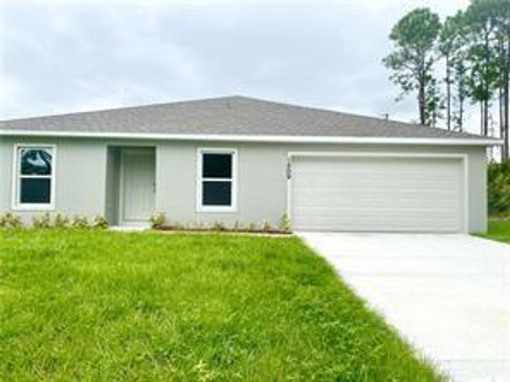 Photo of 1509 SW Bermel Ave, Port Saint Lucie, FL 34953 (MLS # F10346324)