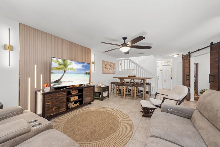 Welcome to this stunning and tastefully remodeled townhome offering comfort, convenience, and style in one of West Palm Beach's most desirable areas. With 2 spacious bedrooms PLUS 1 Guest/Den, 2.5 beautifully updated bathrooms, and new flooring throughout the second level, this home combines modern living with everyday functionality.  Step inside to discover a newly renovated kitchen featuring contemporary finishes, sleek cabinetry, and upgraded appliances—perfect for cooking and entertaining. The open-concept living and dining areas provide a welcoming flow, enhanced by fresh interior paint that brightens every room.  Upstairs, each bedroom offers the privacy of its own en-suite bathroom, creating a perfect setup for families, guests, or shared living. The additional den area can easily serve as a home office, playroom, or guest space.  Located in a well-kept community with a low HOA, residents also enjoy the flexibility of commercial vehicle parking with special permit approval rare benefit in the area.  Property Highlights:  2 Bedrooms + Den | 2.5 Bathrooms Newly Remodeled Kitchen Updated Bathrooms Freshly Painted Interior New Flooring Upstairs Each Bedroom with En-Suite Bathroom Low HOA Fees Commercial Vehicles Allowed (with permit) Convenient Location near Shops, Dining & Major Roads  This home is move-in ready and ideal as a primary residence, seasonal retreat, or investment opportunity. Don't miss your chance to own this gem in the heart of West Palm Beach!