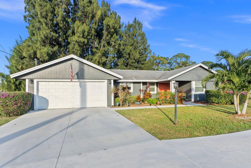 Photo of 701 SE Polynesian Avenue, Port Saint Lucie, FL 34983 (MLS # R10940094)