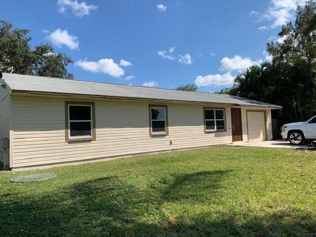 Photo of 1937 SW Capeador Street, Port Saint Lucie, FL 34953 (MLS # R10749714)