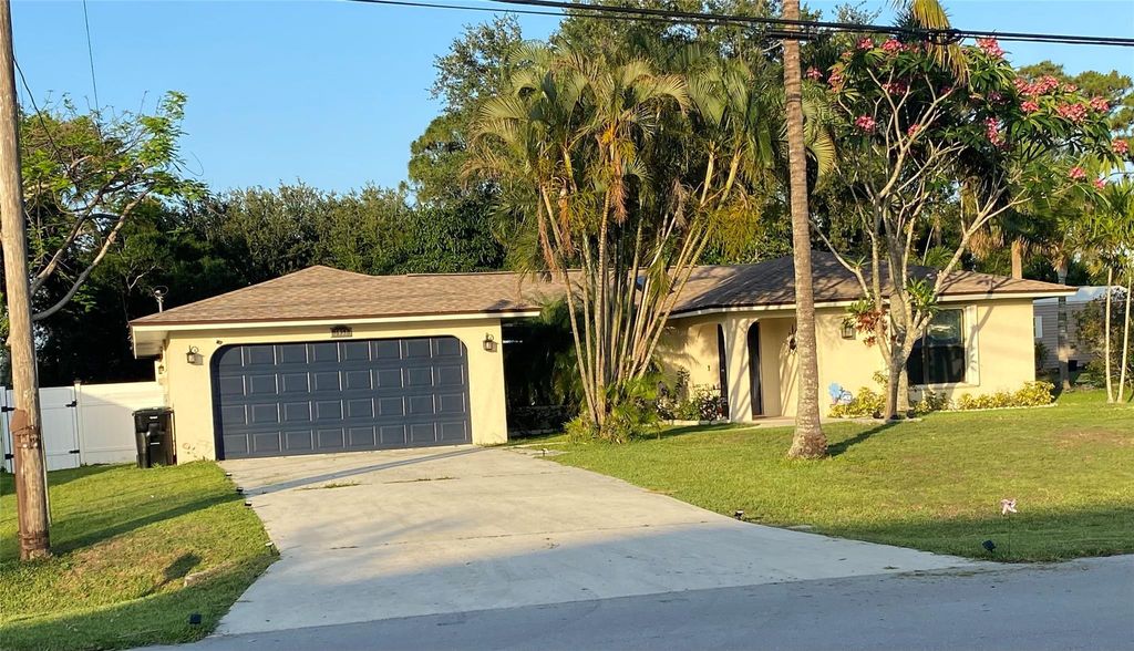 Photo of 3951 SW Cheribon Street, Port Saint Lucie, FL 34953 (MLS # F10506332)