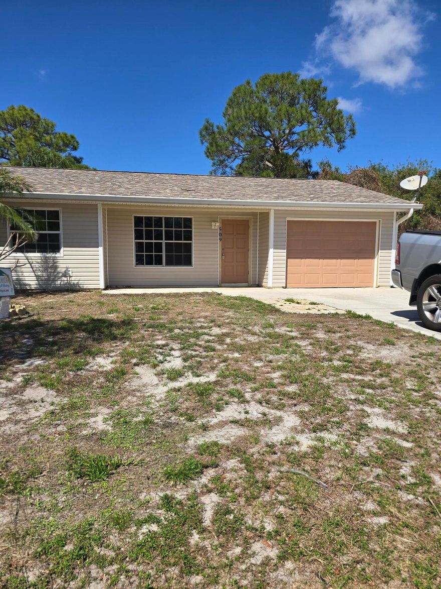 Recently updated 3-bedroom, 2-bath single-family home with 1-car garage and 2-car driveway. Features new bedroom floors, master bath fixtures, and ceiling fans throughout, plus fresh paint. The kitchen includes a new range and hood, and major updates include new roof, siding, water heater, and electrical panel. Additional upgrades: updated window hardware and maintained garage door. Move-in ready and located in a great Port St. Lucie neighborhood!  PLEASE READ: 1st month $2,000 + Security Deposit $2,000 = $4,000 total due for move-in. Renters insurance and utilities transferred to tenant's name required. Requirements: Good payment history on credit report; gross income ideally 3x the rent ($6,000).