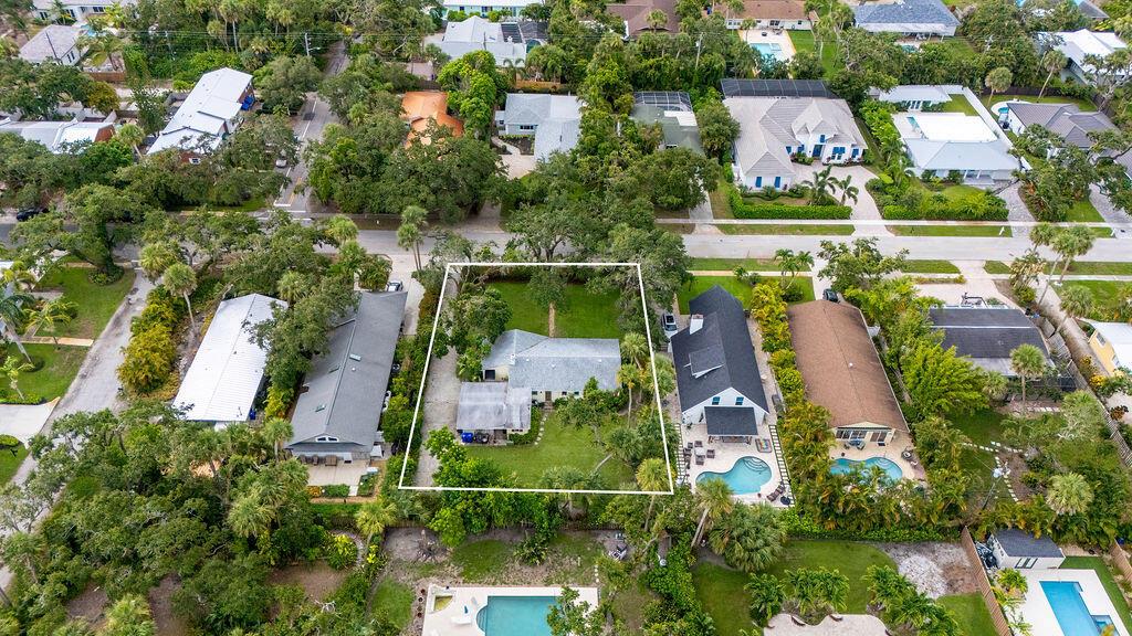 Extraordinary, east of A1A central beach location for this Rare 100X140ft lot and 1400 sq ft concrete block home. Let your creativity shine as you reimagine this home or build a new one! 2018 roof, 2024 A/c, city water & sewer, plenty of room for a pool, beautiful live oaks adorn the property, a little more than half a block to shops, restaurants and beach!! Don't miss this opportunity!!!