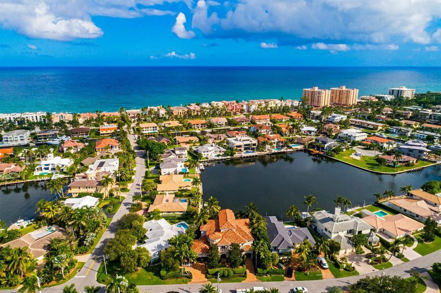 PRICED BELOW APPRAISED VALUE! Stunning Beachside Waterfront Property located on Yacht Basin with Panoramic Views. Easterly breezes set this Tuscan-Transitional style home apart from all the others. With Soaring ceilings, top of the line finishes, state of the art Movie Theater room with loft & wet bar, impact glass, full house generator, air conditioned garage, resort style amenities featuring a grand loggia with heated pool & spa, Summer kitchen, PRIVATE BEACH ACCESS, 70ft of waterfront and terrace views from almost every room. Featuring 5 BRs 5 & 2 1/2 baths, beautiful Jerusalem limestone throughout, Gourmet Chefs kitchen with Wolf, Meile, Gaggenau and Subzero appliances. Master BR features fireplace, custom sound system, morning bar and walk-in closets with his and hers bathroom, ... heated floors& Jacuzzi. Extra features include 2 laundry rooms, crestron system, and Elevator. Dock your 68' foot yacht behind this rare and gorgeous home located in Bel Lido.  Minutes to the inlet by boat.  No need to look any further as this is a boaters dream! Shown by appointment only to pre qualified buyers.