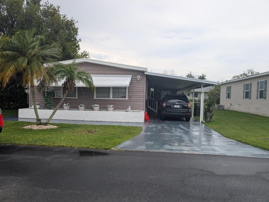 Photo of 32 Manor Drive, Fort Pierce, FL 34982 (MLS # B26060255)