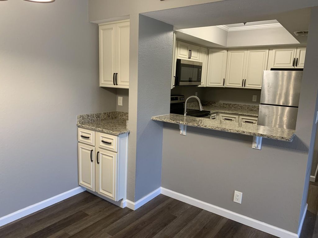Photo of 1548 SE Royal Green Circle #105, Port Saint Lucie, FL 34952 (MLS # B26021084)