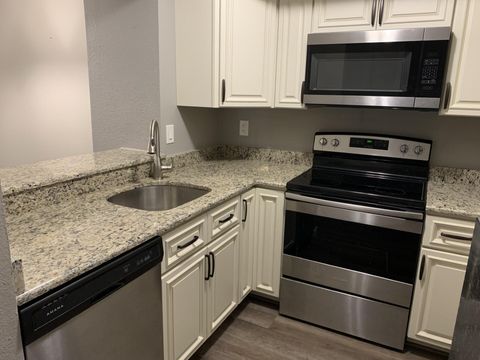 Photo of 1548 SE Royal Green Circle #105, Port Saint Lucie, FL 34952 (MLS # B26021084)