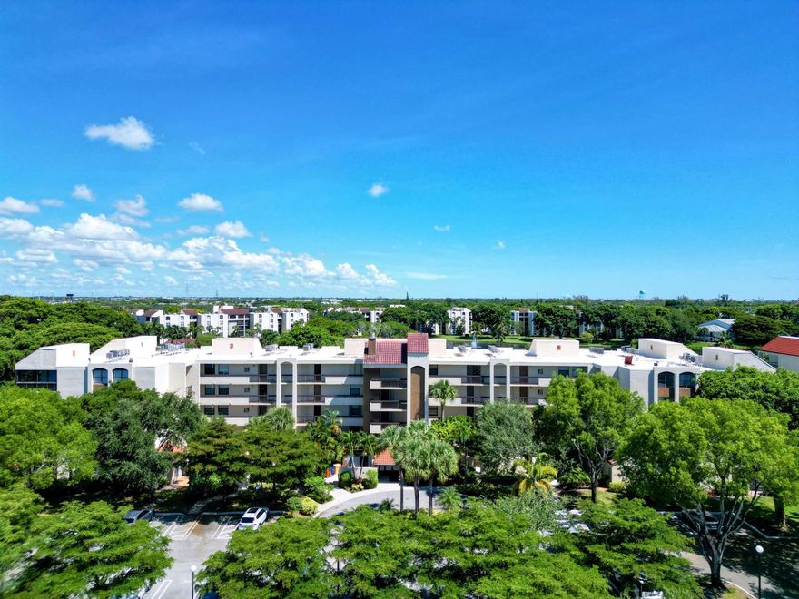 Feeling the chill? Discover your warm-weather retreat. Escape the cold and enjoy sunny South Florida in this spacious 2-bedroom, 2-bath corner condo at Delray Racquet Club. With approximately 1,400 sq. ft. of living space, this bright and inviting home features beautiful lake and garden views from a private balcony.Fully furnished and move-in ready, the condo offers an open layout, large laundry room with washer and dryer, and a blend of tile and premium laminate flooring throughout -- no carpet anywhere.Enjoy resort-style amenities including heated pools, spa, tennis, racquetball, and scenic walking paths. WiFi, cable, water, and parking are included.