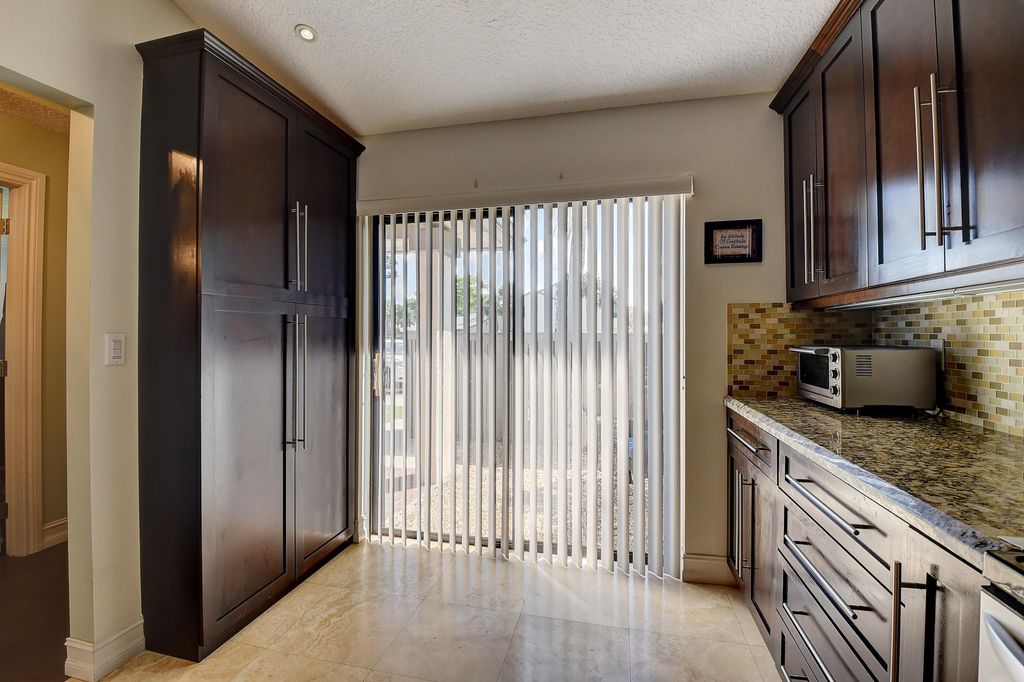 Photo of 8458 Boca Glades Boulevard E, Boca Raton, FL 33434 (MLS # B26007452)