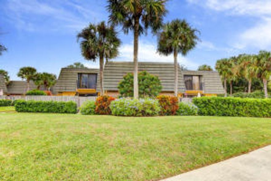 Lake view, well maintained townhouse located at the Villages of Sandalwood in West Palm Beach. Just off of Village Blvd near Cityplace, Downtown WPB, Outlet Stores, beaches and much more! Low HOA fee, $325 includes water, sewer, basic cable service, landscape and maintenance of roof and fence. This townhouse has two bedrooms, 2.5 baths and large fenced in patio.  Call today for private showing.