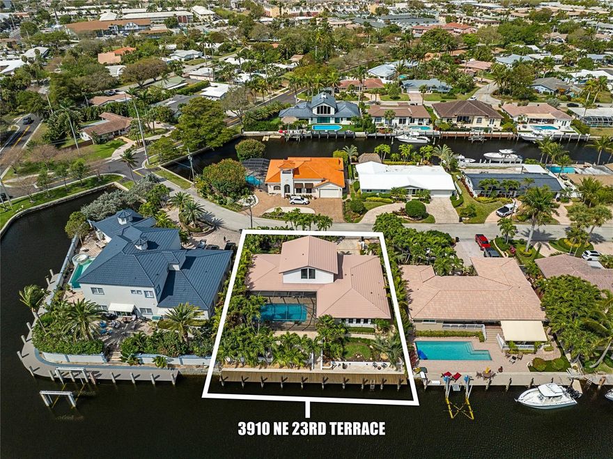 This Venetian Isles stunner with 3 beds + office and 2.5 baths is sure to impress! From the minute you drive through the gated entry the pride of ownership is apparent when see the beautiful landscaping and curb appeal of this home. Step inside to a totally remodeled home with 2 beds,an office and 1.5 baths downstairs and a huge owner's suite upstairs with a walk-in closet, bath, dressing room and sitting area. The kitchen boasts gorgeous piano wood and white cabinetry with high-end Wolf and subzero appliances.  There is a matching wet bar in the family room with wine and beverage coolers.  Step outside into a private oasis with a screened in pool and outdoor kitchen, with access to the cabana bath, surrounded by a marble patio looking out onto 90 feet of dockage.