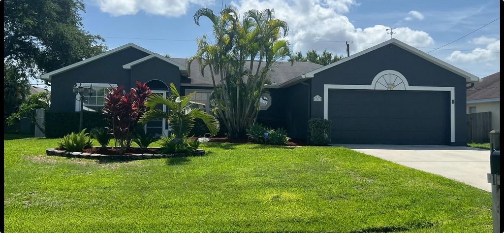 Photo of 131 NW Friar St, Port Saint Lucie, FL 34983 (MLS # F10444993)