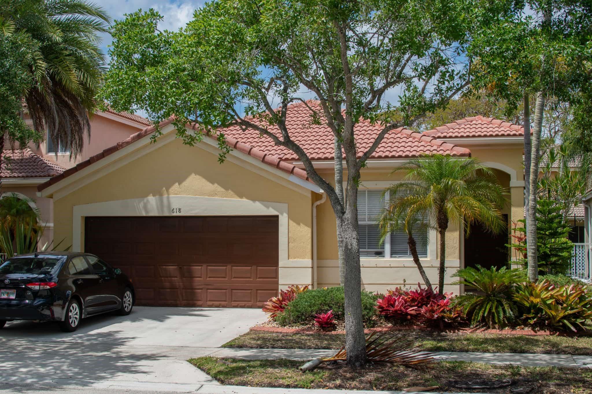 Welcome to one of the most highly sought after and most desirable neighborhoods in Weston. This home is completely remodeled. All new flooring Italian ceramic tile throughout living areas and bedrooms. Kitchen also remodeled with Euro style extended cabinets and quartzite counter tops, all black stainless-steel appliances. Both bathrooms also recently remodeled with free standing tub in main bathroom. Washer and dryer inside the home for your convenience. Sliders to an extended screened patio for your outside entertainment. Resort style clubhouse and amenities with heated pools, baseball, soccer fields, hockey arena, and children`s play area and crazy golf. Make this your home for you and your family!!