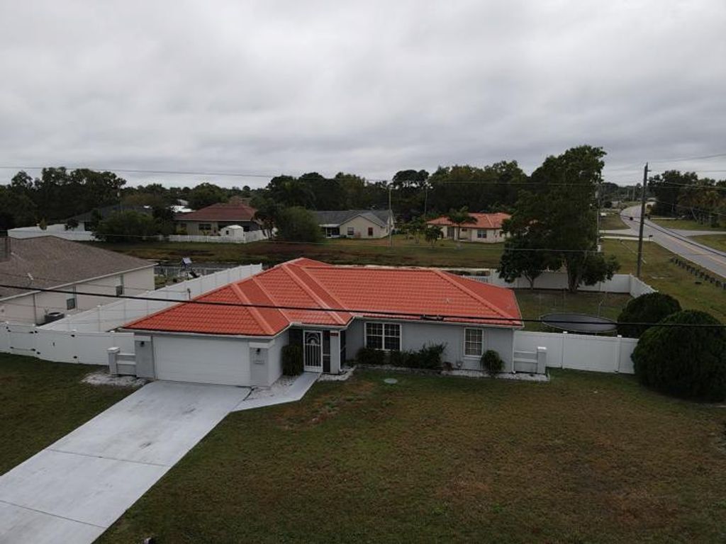 Photo of 2199 S Buttonwood Drive, Port Saint Lucie, FL 34952 (MLS # R10775928)