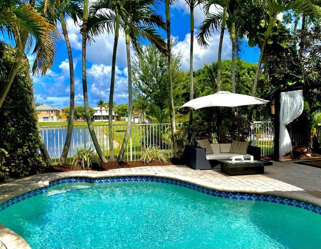 Photo of 6912 Spider Lily Lane Ln, Lake Worth Beach, FL 33462 (MLS # R10823923)