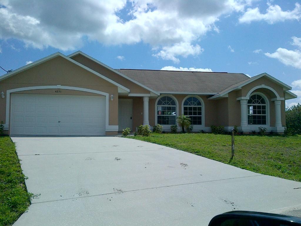 Spacious 4-bedroom home with vaulted ceilings, wood like flooring, formal dining room, family and living room, built ins, arched doorways and windows, stainless steel appliances and washer and dryer, all window covering and paint. covered patio, private setting, with split floor.