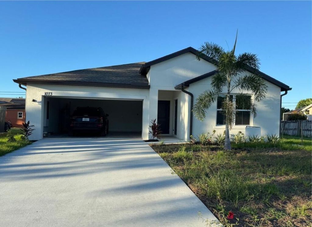 Photo of 1073 SW Benchor Avenue, Port Saint Lucie, FL 34953 (MLS # R11139705)