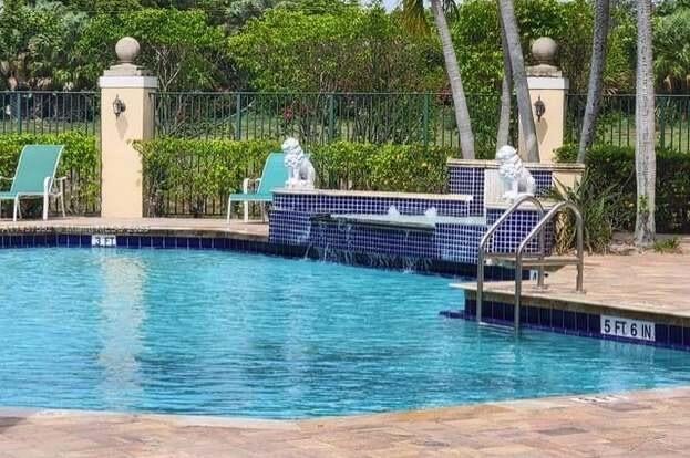 Photo of 1749 Village Blvd #103, West Palm Beach, FL 33409 (MLS # R10929267)