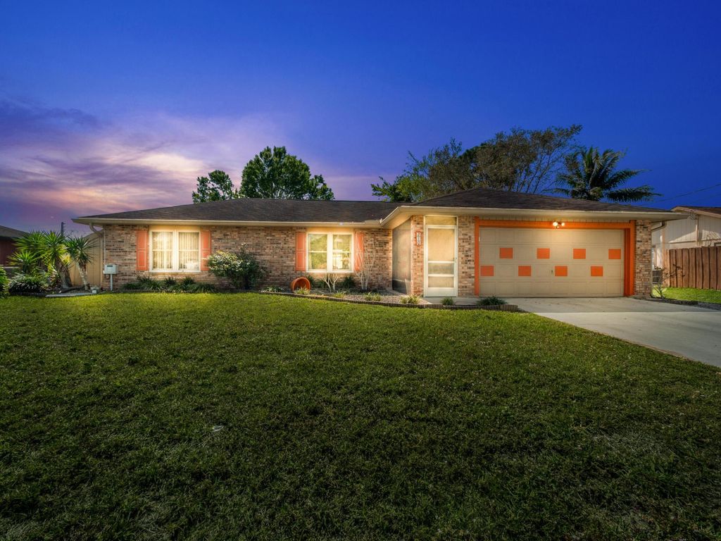 Photo of 210 SW Amesbury Avenue, Port Saint Lucie, FL 34953 (MLS # R10963239)