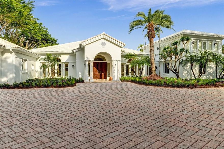 This Hurlingham Drive estate offers traditional luxury at stately proportions. Custom box molding adds lush texture, expansive gallery walls await your art collection, and soaring tray ceilings and gracious thresholds allow abundant sunshine to flow throughout the interior. Relax in your palatial yet tranquil primary sanctuary. Dual dressing rooms, a sunny sitting area, and a spa-worthy bath make it an ideal retreat for two. Entertain a crowd in the great room. The party will flow outdoors through the wall of French doors, revealing a resort-style patio and swimming pool. The golf course views are a perfect backdrop, whether you throw a casual pool party or a formal affair. A large kitchen offers plenty of counter space, designer appliances, and a butler’s pantry to prepare for guests. After everyone’s left, you’ll love spending the long South Florida days in your outdoor living room.