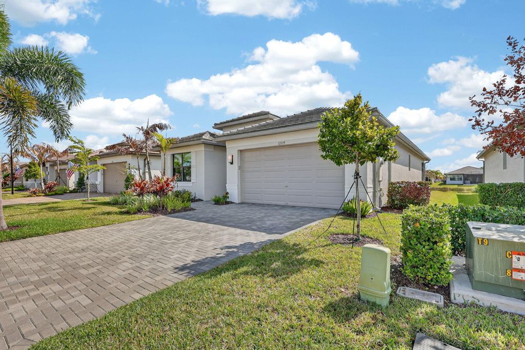 Photo of 12719 SW Blue Mangrove Parkway, Port Saint Lucie, FL 34987 (MLS # B26012918)