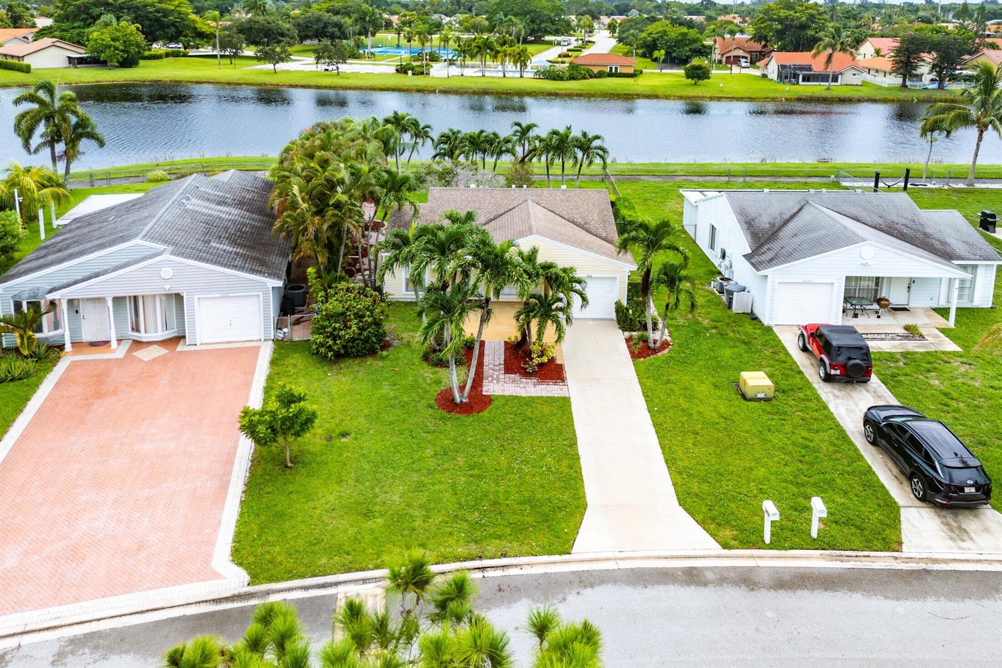 Hi, I'm 5456 Courtney Circle. I haven't had a makeover in awhile but I have great bones and I'm in an amazing location! Need some storage space? I have a garage! Need a fenced yard? I've got a large one on a lake. Need an open layout? Hey! That's me too! Oh wait! Don't need storage space? You can turn my garage into another bedroom. I'm on a quiet street in a neighborhood with a walking trail, a pool, tennis courts, basketball and a playground! If you see my worth come by this weekend and see me