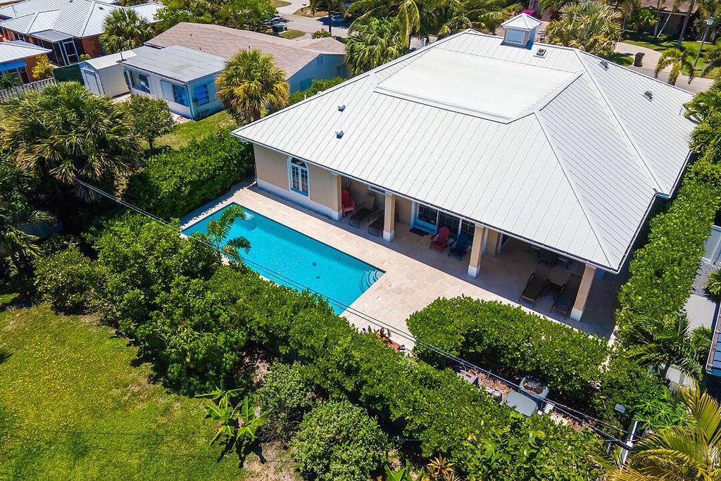 Photo of 218 Sandal Lane, Palm Beach Shores, FL 33404 (MLS # R10948945)