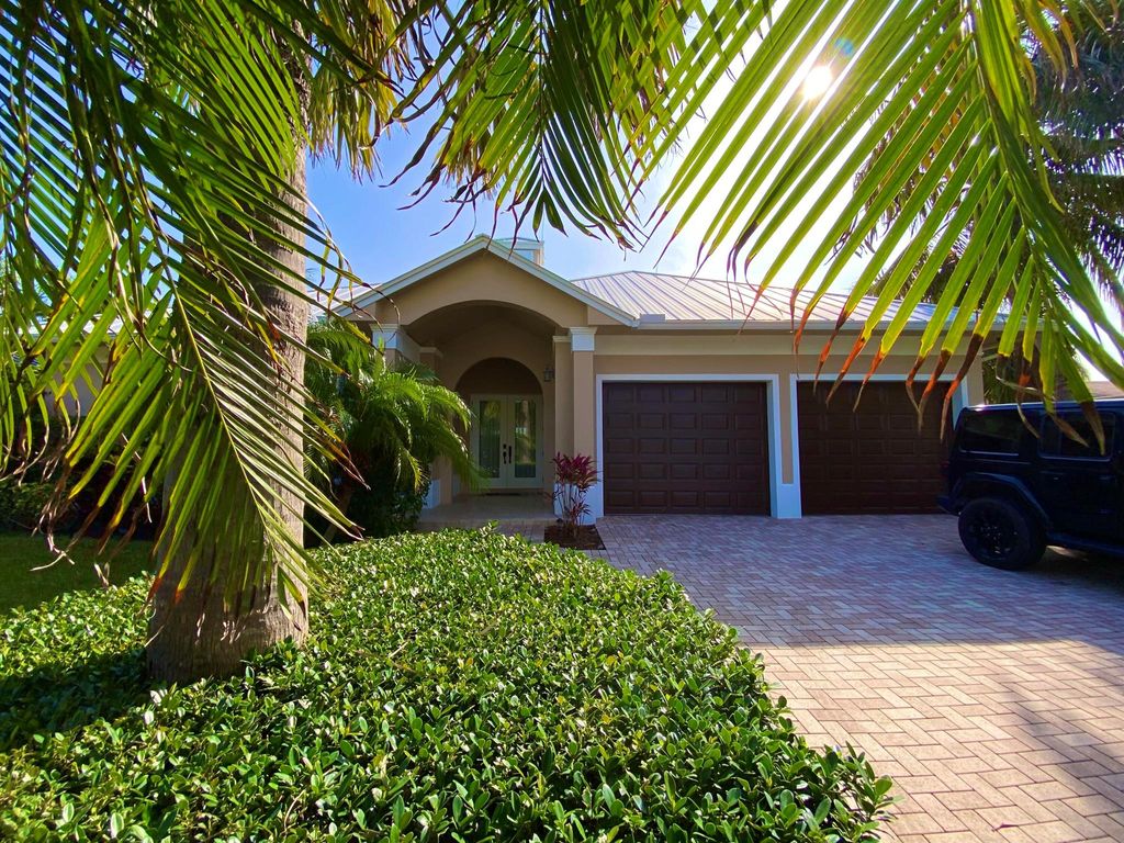Photo of 218 Sandal Lane, Palm Beach Shores, FL 33404 (MLS # R10948945)