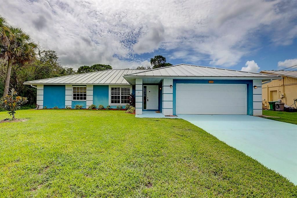 Photo of 1032 SW Romaine Lane, Port Saint Lucie, FL 34953 (MLS # R10746862)