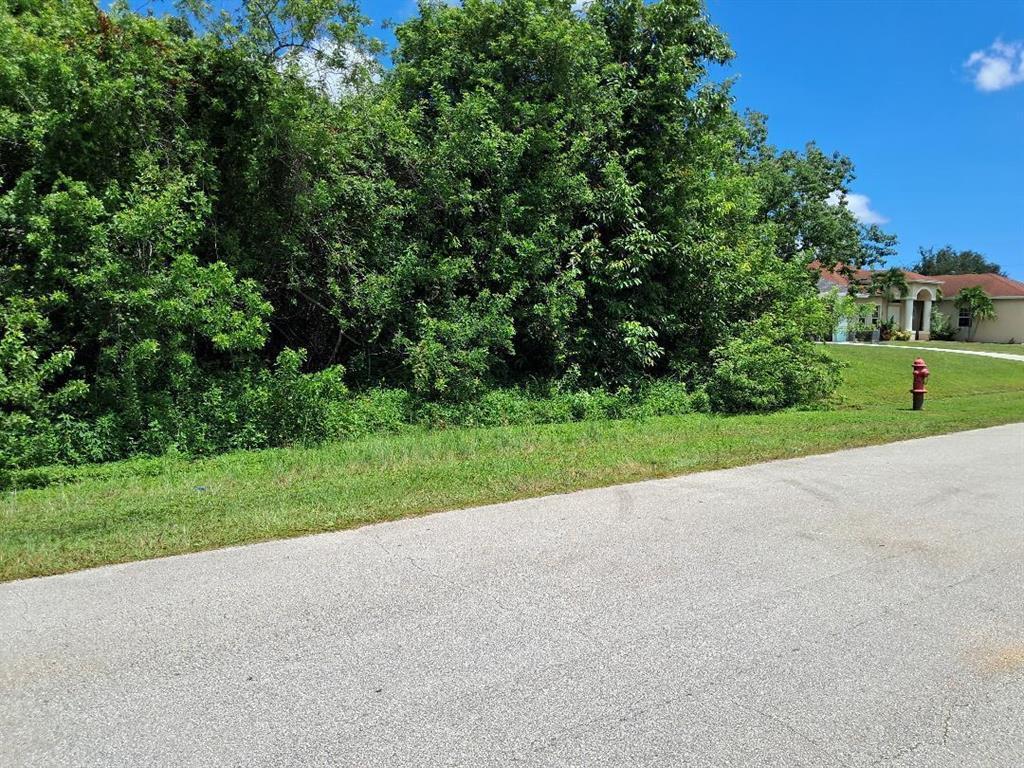 Photo of 1081 SW Dartmouth Avenue SW, Port Saint Lucie, FL 34953 (MLS # B26045393)