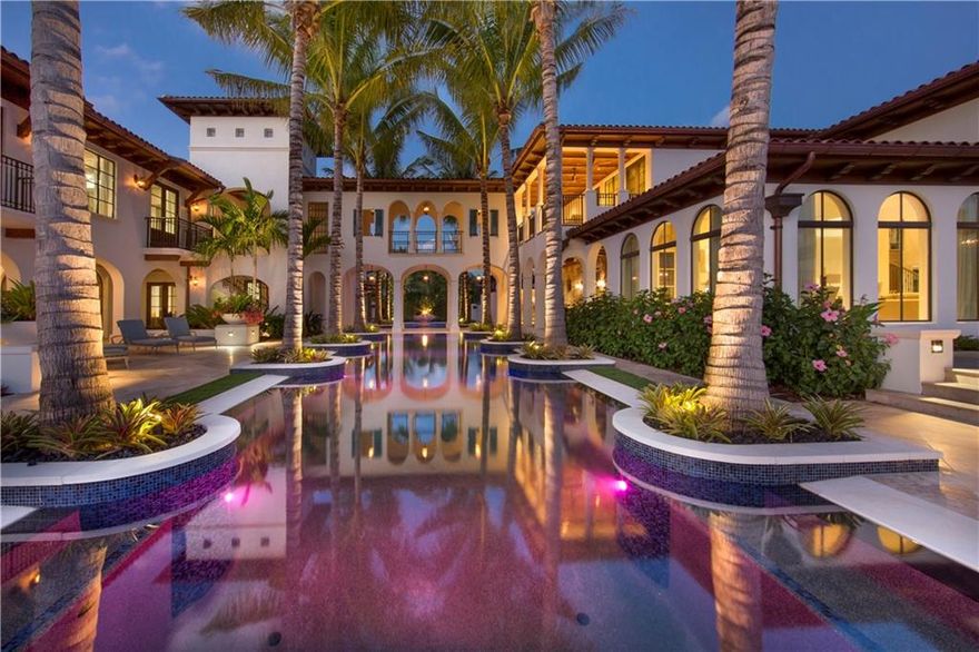Casa Bianca - Extraordinary deep-water custom built compound - authentic sophisticated Santa Barbara inspired styling with clean contemporary elements! 205 ft dock one off intracoastal. Rarely understated & unique elegance main house 6 bedroom suites plus totally private 3 bedroom suite guest house (optional 4th bed). Walled & gated for privacy, resort style grounds offer 3 different pool environments.Highest quality finishes, main 12 room residence offers ultimate Chef's kitchen, large open family & breakfast rooms, formal living & dining rooms, library/club room.Master Suite:private balcony, outdoor shower & spa, dual private offices. Spacious covered loggias & incredible outdoor lounge with bar & fireplace, adjacent cabana suite & connoisseur quality wine cellar. 5 Bay AC garage - Residence is walled and gated to create the intimate but welcoming feel of a private compound, separate service entrance- Multiple cameras throughout- Double gated courtyard entry open to the dramatic checkerboard pattern entry foyer with timelessly welcoming Olde-World elegance- Incredible custom details: authentic reclaimed Bourgogne limestone walls from Burgundy, France.- Under-lighting with quartz counters in the bar/club/library room- Hand selected reclaimed wood beams & custom tongue & groove ceilings throughout- Ultra-contemporary Bulthaup stainless steel kitchen - $600,000 cost- $1m plus home automation, media & audio package- Custom build by Gulf Builders commenced in 2012 and was completed in 2014 - Two story bridge connects the main house to the private guest house- Three pools - lap swimming pool, secondary pool & main sensuous lagoon pool connect under the bridge to guest house. Poolside you have a covered loggia lounge with fireplace and cabana suite with private entry and bath (potential 4th/1st level bathroom)- 12 room main house extremely flexible open concept kitchen-living-dining areas - all in soft color palette with extensive oak paneling in the library/club room- Master Suite is the perfect retreat with large private sitting area adjoining the bed room with access to the private balcony with spa and outdoor shower, incredible views out to the intracoastal  Also enjoy spa style bath, custom closets & two private offices (private rear staircase)- The guest house is as luxuriously appointed as the main residence but with a more coastal modern feel. - 205ft of straight-line dockage with floating dock & boat lift - power & electric, perfect for a large or multi yachts