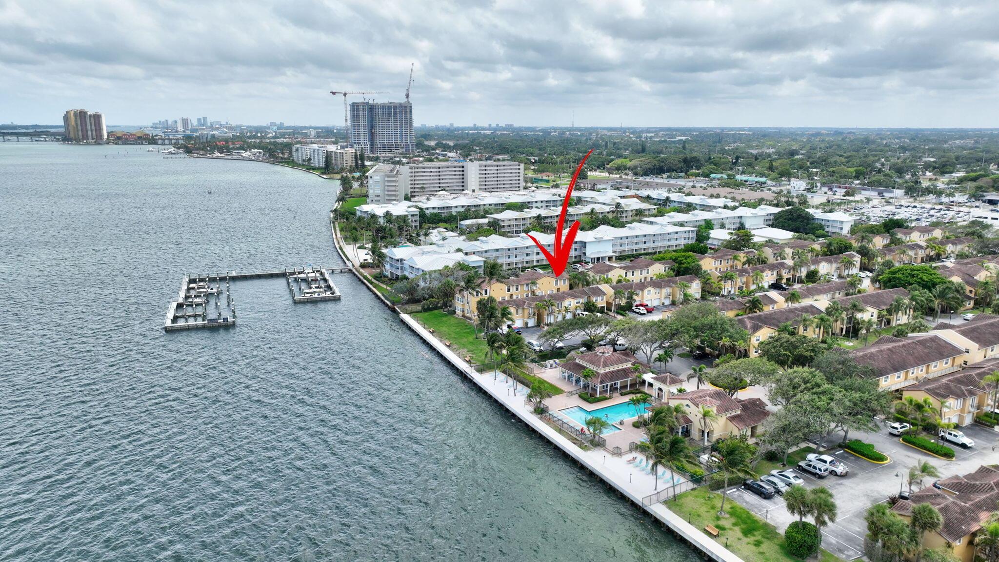 Welcome to your dream home in the heart of North Palm Beach! This stunning 2-bedroom, 2-bathroom end unit, 2-story condo is located in the highly sought-after Bay Reach community, an intracoastal paradise offering a unique blend of luxury and convenience. Step inside to discover a beautifully updated unit featuring elegant granite countertops, contemporary tile flooring, and modern bathroom vanities. The recent updates also include new toilets, Hurricane windows, and a tankless water heater. The AC and washing machine are only 1 year old, and the unit includes a washer and dryer. The kitchen, dining room, and living room overlook the balcony, letting natural sunlight in. All the windows have pull-down shades throughout the unit, enhancing privacy and comfort.