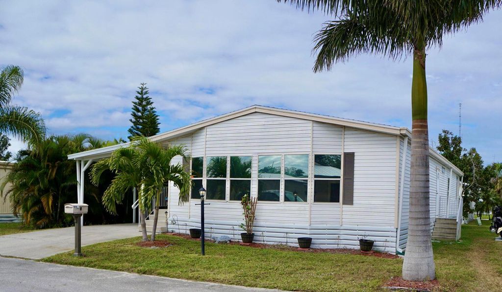 Photo of 8 Andalusia Lane, Port Saint Lucie, FL 34952 (MLS # R11112303)