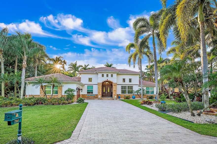 A move-in ready ''mini-mansion'' situated on the 18th fairway. This exquisite home boasts many unique fixtures and finishes including 17-ft ceilings. A beautifully renovated kitchen includes coffered ceilings, custom wood cabinets, double ovens, warming drawer, gas cooktop and marble countertops that open to an adjoining den. Gorgeous parquet floors refinished with a grey tone in the great room accentuate 3 sets of French doors which open to the resort-style, patio equipped with pool, gas fire pit and summer kitchen. Both the master suite and cabana guest suite open onto the pool deck. The automated saltwater pool & spa overlook a tropical outdoor oasis. Full house protection ensues with a Generac generator and impact windows. Club membership not required. Soaring palms and professionally landscaped lawns cocoon the outdoor space and offer beautiful views from every room in the home. Just under 1/2 acre, the property is surrounded by lush, mature landscaping that affords complete privacy yet backs on to the fairway of the 18th hole.

No club membership is required, but golf, tennis, and social memberships are available. Amenities of the club include Arthur Hills designed golf course, tennis courts, fitness center, pool, and restaurant.