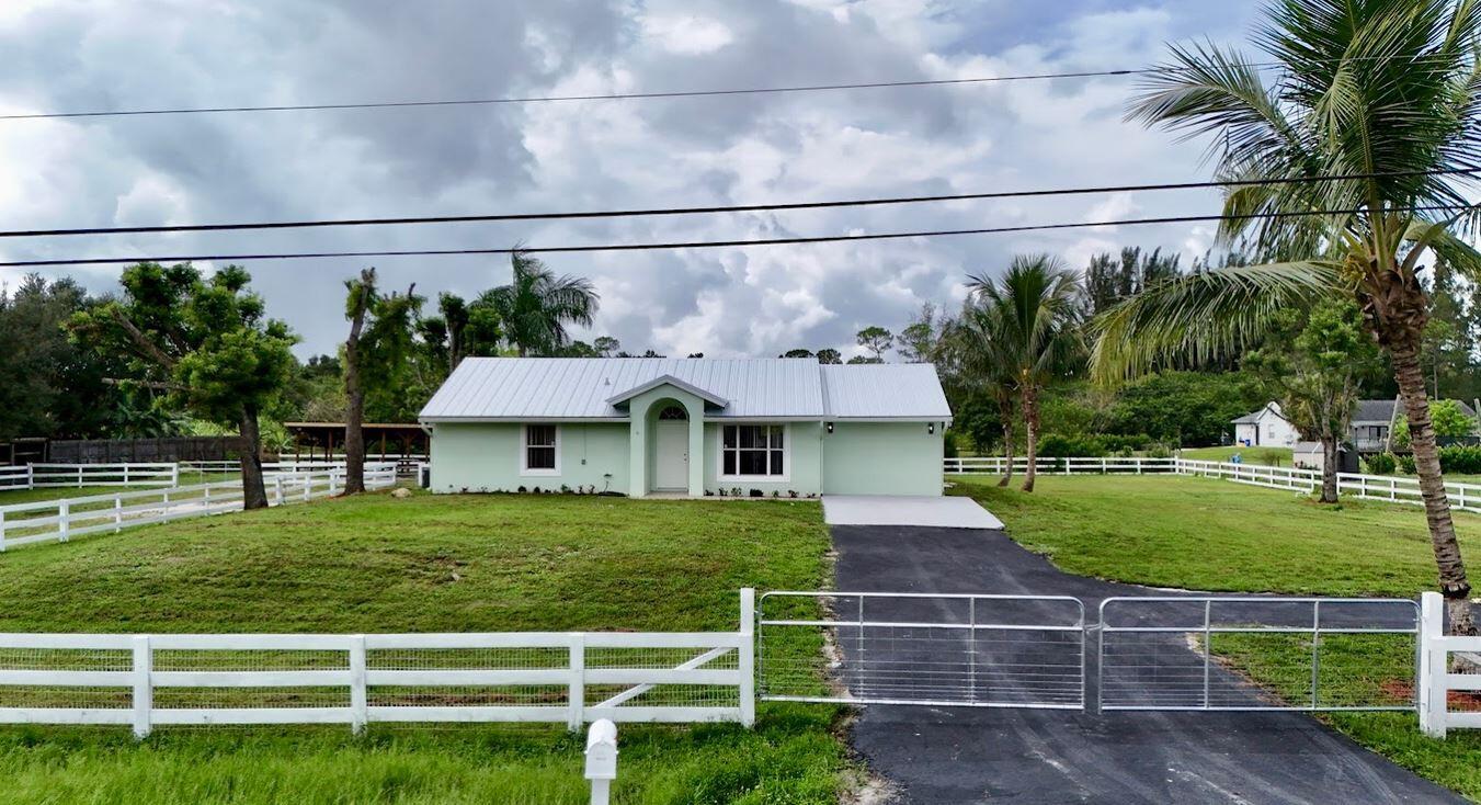 STUNNING 3 BR/ 2 BATH HOME W/ SCREENED POOL, OVERSIZED PATIO, and NEW ROOF on BOTH HOME & BARN. THIS BEAUTIFULLY UPDATED CBS HOME IS PERFECTLY SITUATED ON A DEAD END ST, SET ON OVER AN ACRE OF FULLY FENCED LAND WITH A PADDOCK & BARN. FEATURES: RENOVATED KITCHEN WITH UPGRADED APPLIANCES & FINISHES * UPDATED BATHROOMS WITH HIGH END FIXTURES * THE ONE CAR GARAGE HAS BEEN CONVERTED INTO ADDL LIVING SPACE (not included in the sq ft listed) WHICH IS PERFECT FOR A BONUS ROOM, OFFICE OR GUEST SUITE. * * BONUS DETACHED STRUCTURE WITH NEW ROOF THAT CAN SERVE AS A 3 STALL BARN, COVERED WORK AREA OR BE CONVERTED TO A CARPORT OR GARAGE, Owner may consider financing options for the right buyer.