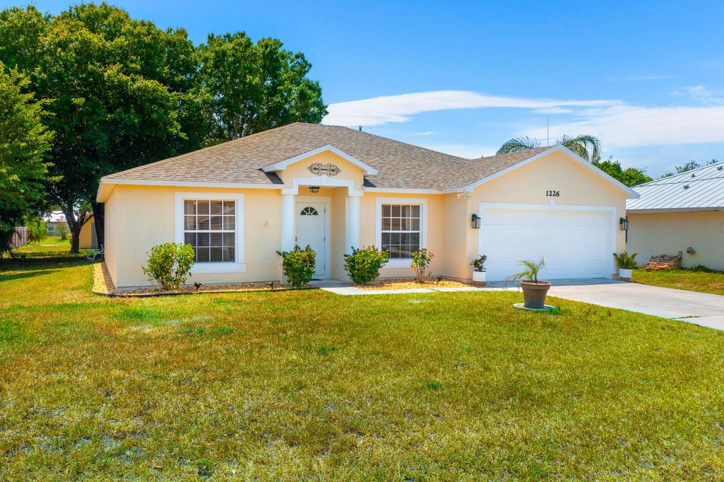 Photo of 1226 SW Asturia Avenue, Port Saint Lucie, FL 34953 (MLS # R10986695)