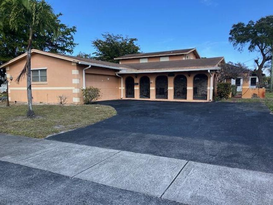 This property is a 4 bedroom 3 bath 2 car garage home situated on a .29 acre lot. This is a concrete block home that sits on a corner lot. A large front screened porch that also has a rear second floor balcony. A large green area to the right of the home. This property needs TLC.