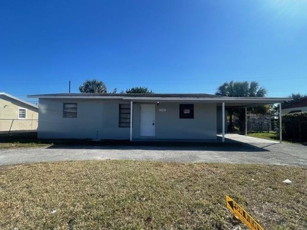 Photo of 1129 W 23rd Street, Riviera Beach, FL 33404 (MLS # F10555036)