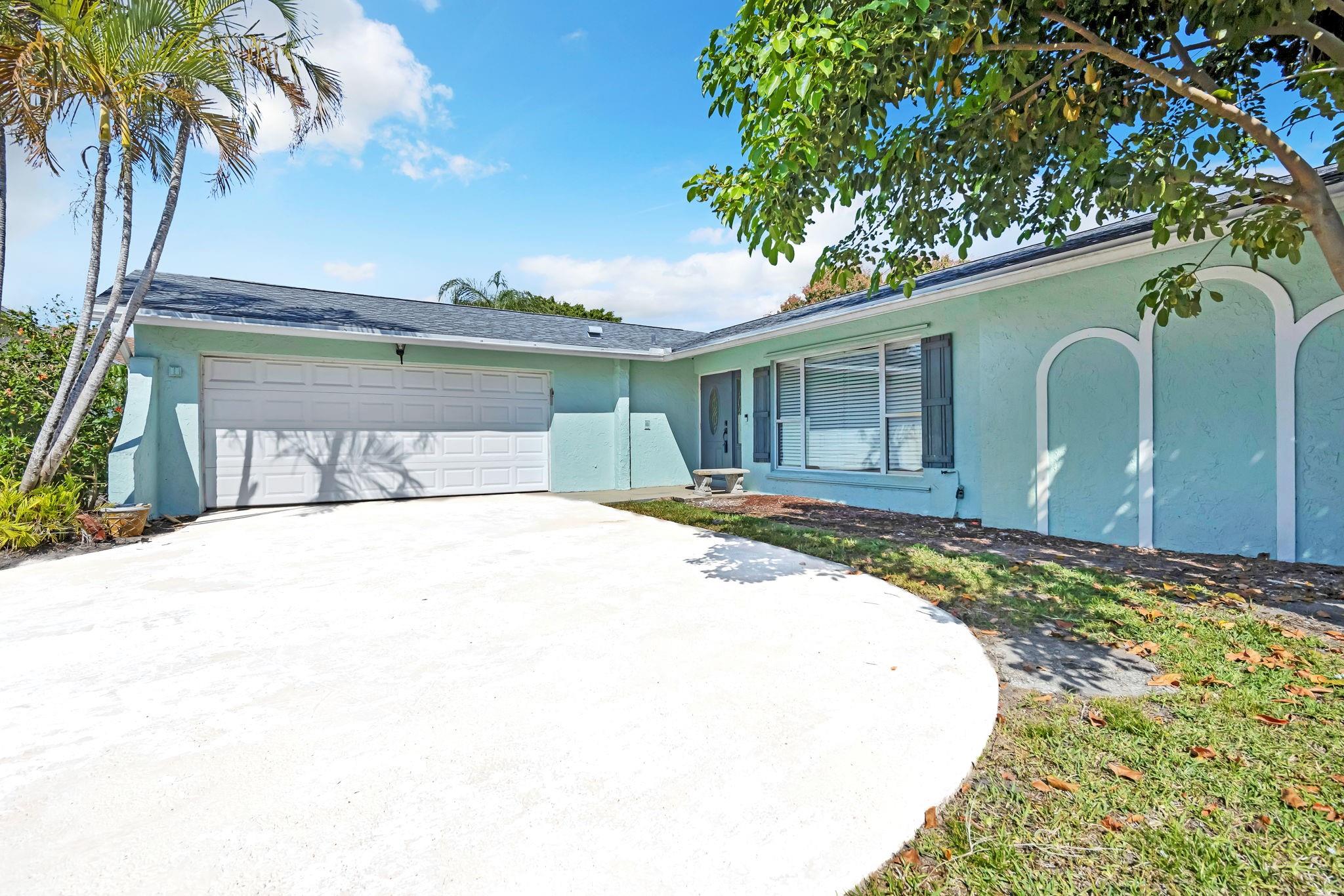 An incredible one-story single-family home in Wellington. This spacious home offers 4 bedrooms, 2 baths, an in-ground pool, a screened patio, and lots of green area with great Mango trees. The home features great living space, a living room and family room, 2 2-car garage, and a laundry room. Remodeled bathrooms, and spacious room closets. New pool and sprinkler system. NO HOA ...This a must see!!!